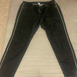 Denim jeans with zippers on both sides. Worn a couple of times